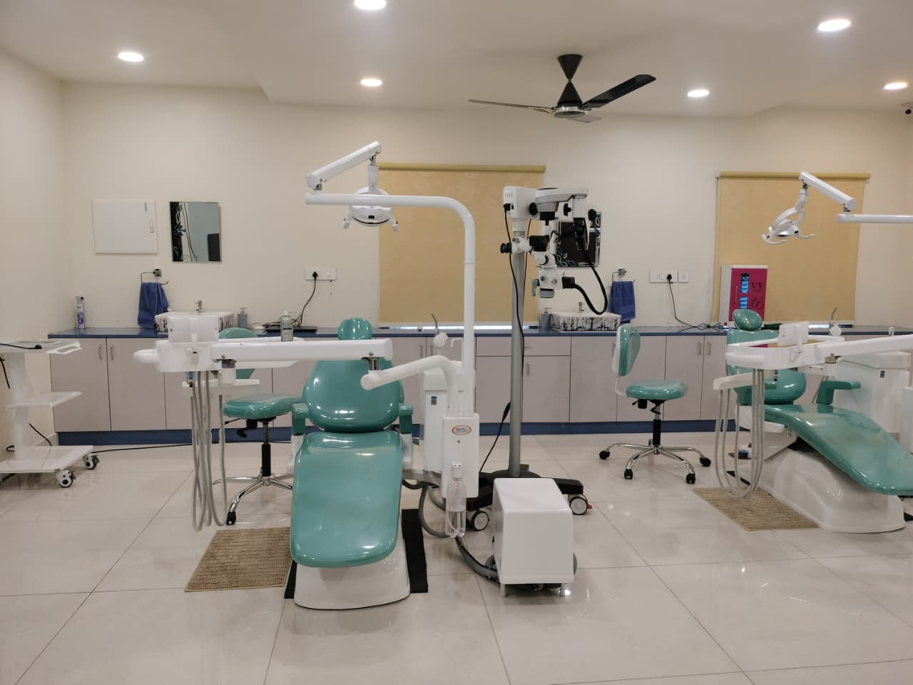 Dental treatment room with operating microscope at Dr. Bharath Dental